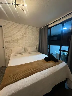 Uma cama ou camas num quarto em 204 Atlântico Residence