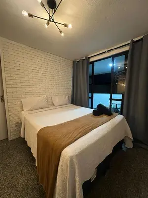 Uma cama ou camas num quarto em 204 Atlântico Residence