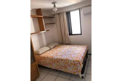 Uma cama ou camas num quarto em Condomínio Porto de Iracema