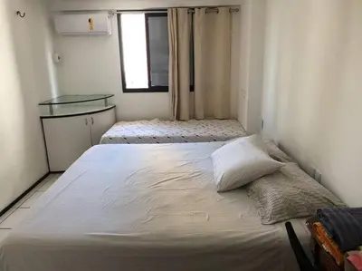 Uma cama ou camas num quarto em Condomínio Porto de Iracema