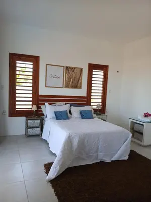 Uma cama ou camas num quarto em Bangalô Exclusivo Pontal do Maceió