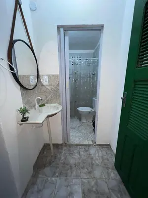 Uma casa de banho em Nativa casa principal