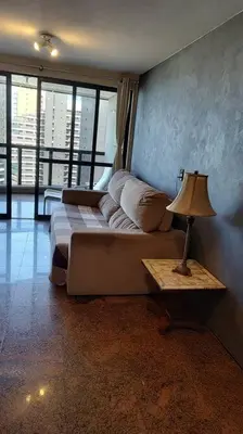 Uma área de estar em Flat Atlântico linda vista 1503