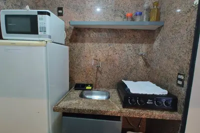 A cozinha ou kitchenette de Flat Atlântico linda vista 1503