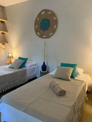 Uma cama ou camas num quarto em Casa Bela Vida