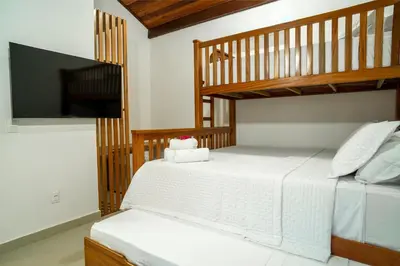 Uma cama ou camas num quarto em Villa do Ze