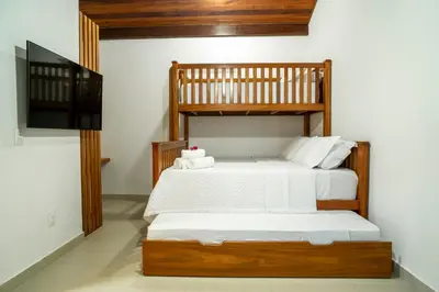 Uma cama ou camas num quarto em Villa do Ze