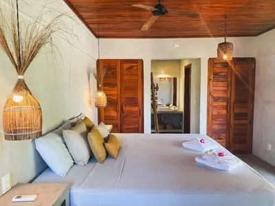 Uma cama ou camas num quarto em Casa Devagar Icaraizinho