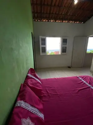 Uma cama ou camas num quarto em Casa Roxa
