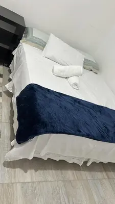 Uma cama ou camas num quarto em Casa de Praia Aconchegante