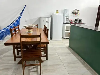 A cozinha ou kitchenette de Casa de Praia Aconchegante