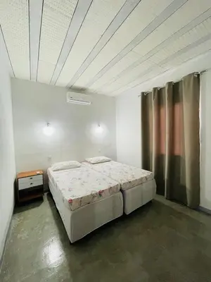 Uma cama ou camas num quarto em CASA Les Deux R da Lagoa