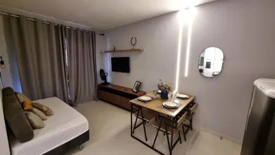 Uma televisão e/ou sistema de entretenimento em Apartamento em Porto das Dunas - Próximo ao Beach Park
