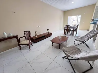 Uma área de estar em Apartamento em Mundaú