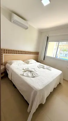 Uma cama ou camas num quarto em Condomínio Boas vistas