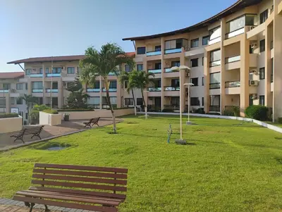 Um jardim no exterior de Flat 500 MTS do Beach park