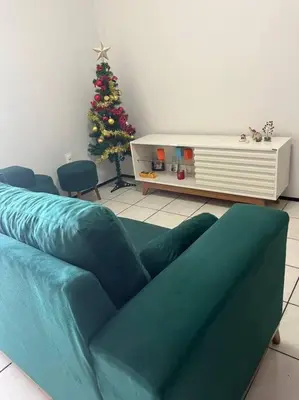 Uma área de estar em Apart Próx à Beira Mar