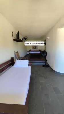 Uma cama ou camas num quarto em Espaço Akronos Residence