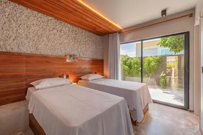 Uma cama ou camas num quarto em Summerville #117 - Luxo no Cumbuco by Carpediem