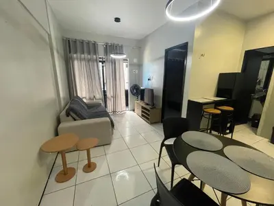 Uma televisão e/ou sistema de entretenimento em Villa Costeira Flat