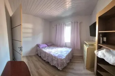 Uma cama ou camas num quarto em Casa Recanto Serra Verde