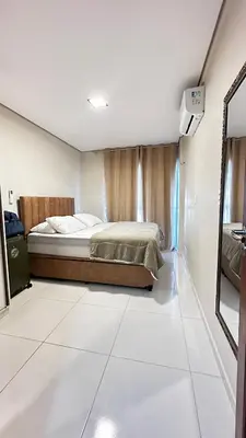 Uma cama ou camas num quarto em Uma quadra do mar de Cumbuco - Ceara