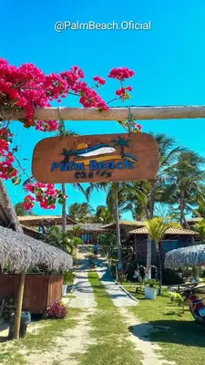 Um jardim no exterior de Pousada Palm Beach Praia de Caetanos Chalé Família