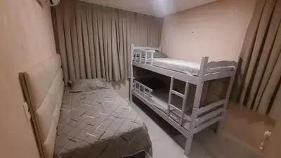 Uma cama ou camas num quarto em Mandara Lanai Beira da Praia