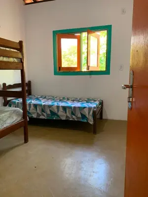Uma cama ou camas num quarto em Canto dos passaros