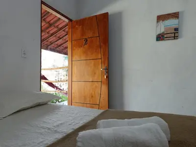 Uma cama ou camas num quarto em Oásis