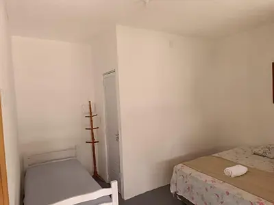 Uma cama ou camas num quarto em Oásis