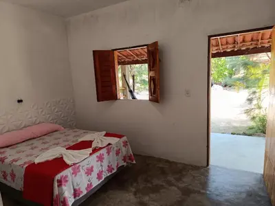 Uma cama ou camas num quarto em Oásis
