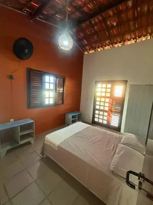 Uma cama ou camas num quarto em Casa de Praia - Praia do Presídio