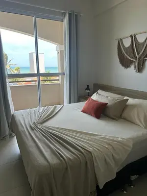Uma cama ou camas num quarto em Cumbuco Residence