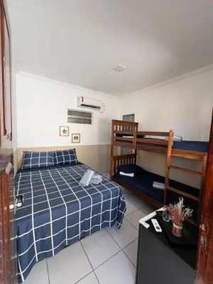 Uma cama ou camas num quarto em Suíte Pé na Areia - Super Local