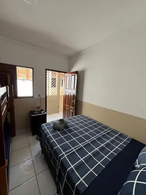 Uma cama ou camas num quarto em Suíte Pé na Areia - Super Local