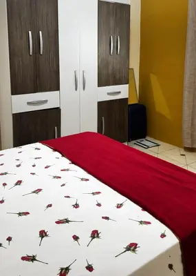 Uma cama ou camas num quarto em Chalê da Lizi