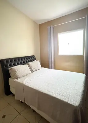 Uma cama ou camas num quarto em Chalê da Lizi