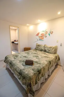 Uma cama ou camas num quarto em Casa Vista ao Mar - Paisagem Deslumbrante e Localização Perfeita