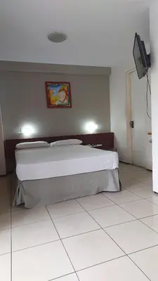 Uma cama ou camas num quarto em REDE APARTHOTEL Praia Mansa