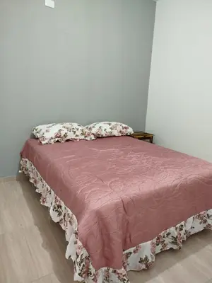 Uma cama ou camas num quarto em Studio Sonho Meu