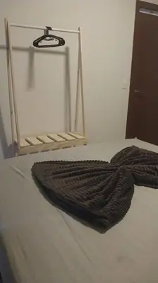 Uma cama ou camas num quarto em Apartamento Sobre as Ondas
