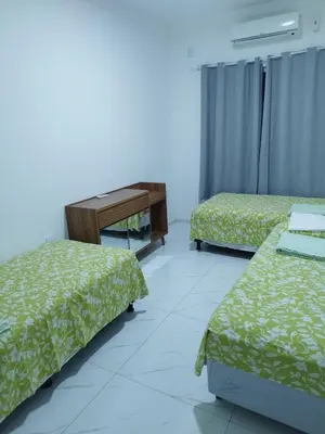 Uma cama ou camas num quarto em Casa Praia Paracuru - Orquídeas de Célia