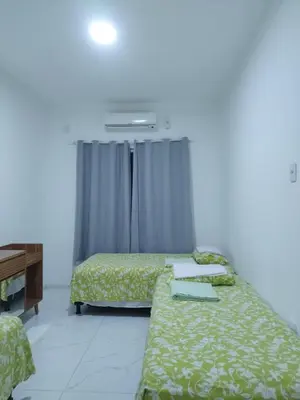 Uma cama ou camas num quarto em Casa Praia Paracuru - Orquídeas de Célia