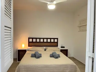 Uma cama ou camas num quarto em Praia Marina Suite - Morro Branco