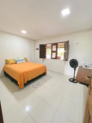 Uma cama ou camas num quarto em Sítio Caju