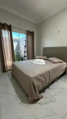 Uma cama ou camas num quarto em Paracuru casa temporada Villa Ariane