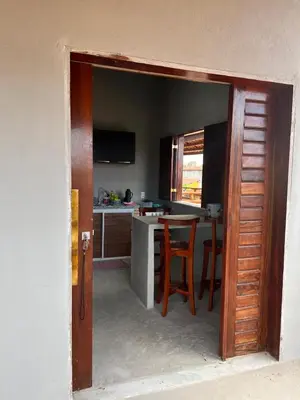 Uma televisão e/ou sistema de entretenimento em Pousada Califa Taíba