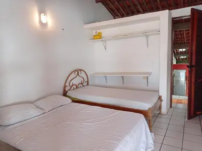 Uma cama ou camas num quarto em Casa Jangada - Incrível vista mar com Piscina e a melhor localização na Beira Mar da Taíba