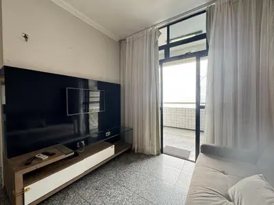 Uma televisão e/ou sistema de entretenimento em New Life Meireles Vista Mar by Escala Imoveis